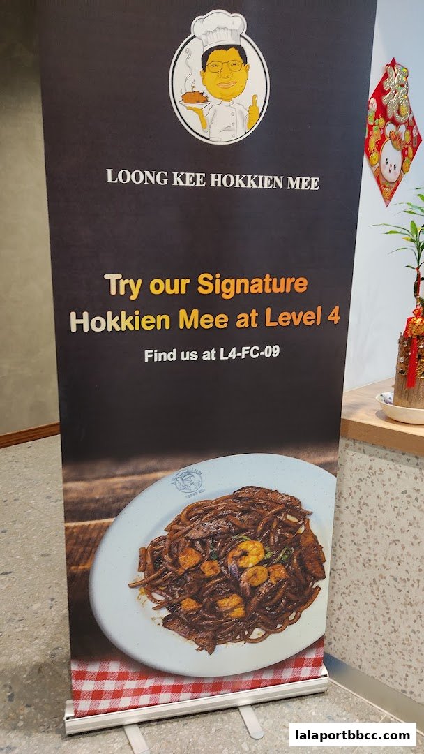 A promotional banner for Loong Kee Hokkien Mee, showcasing their signature dish.