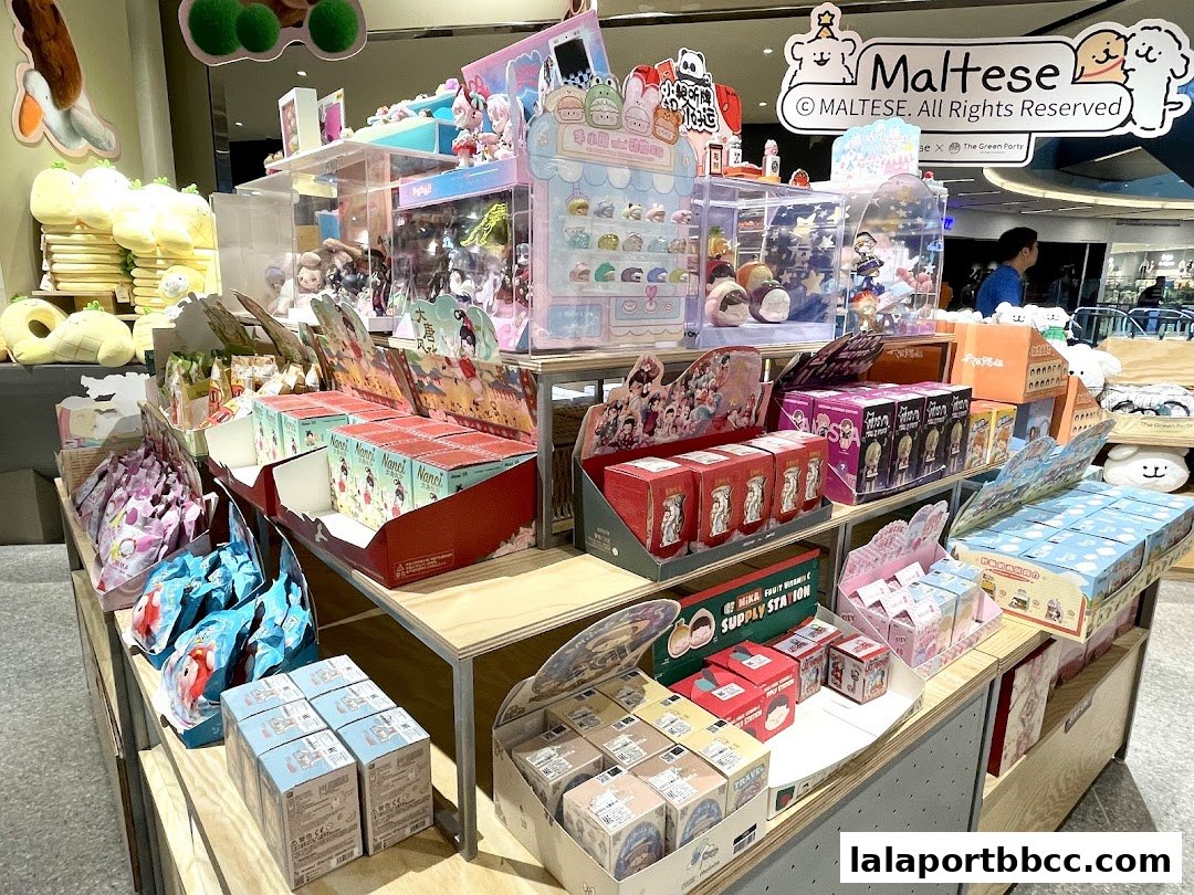 A retail display filled with various blind box toys and plushies, featuring cute characters and colorful packaging.