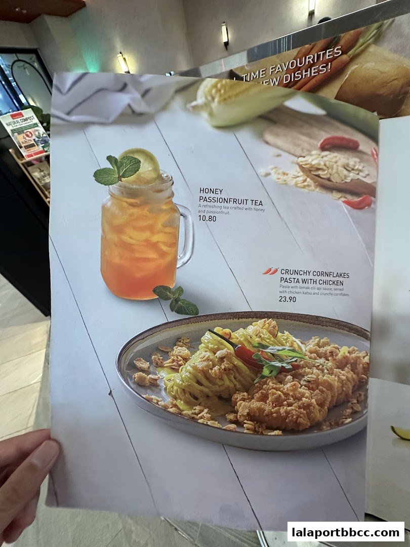 A menu featuring Honey Passionfruit Tea and Crunchy Cornflakes Pasta with Chicken.