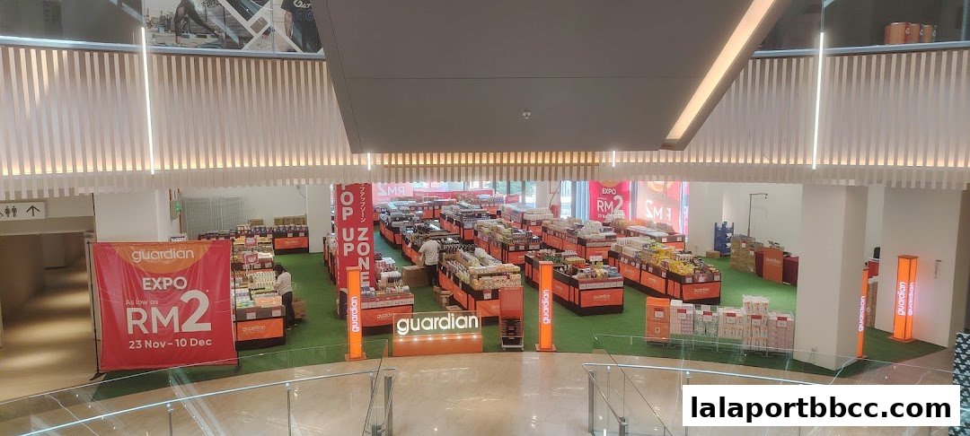 A Guardian pop-up expo with numerous product displays and promotional banners.