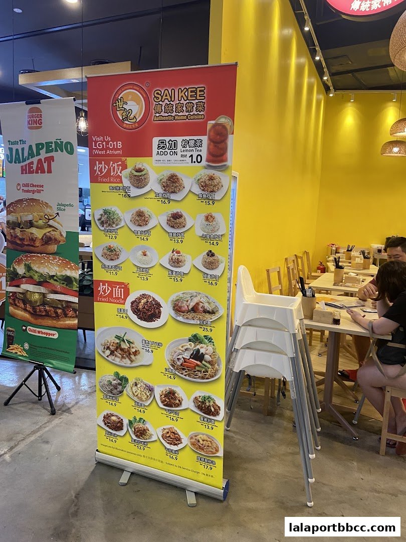 A promotional banner for Sai Kee Restaurant showcasing various fried rice and fried noodle dishes.