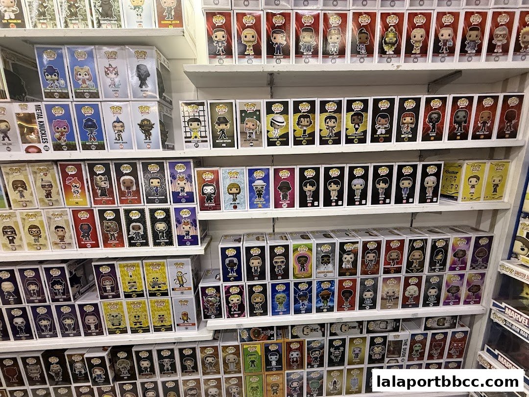 Shelves packed with collectible pop culture figures in their original boxes.