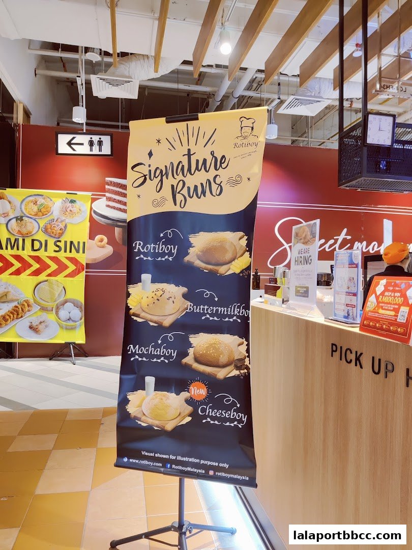 A banner showcasing Roti Boy's signature buns, including Rotiboy, Buttermilkboy, Mochaboy, and Cheeseboy.