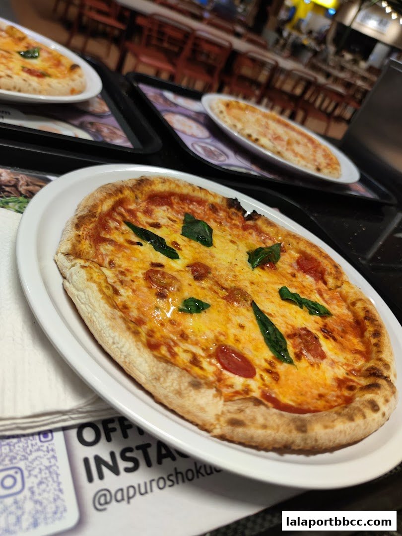 Close-up of a delicious Margherita pizza with fresh basil and cherry tomatoes.
