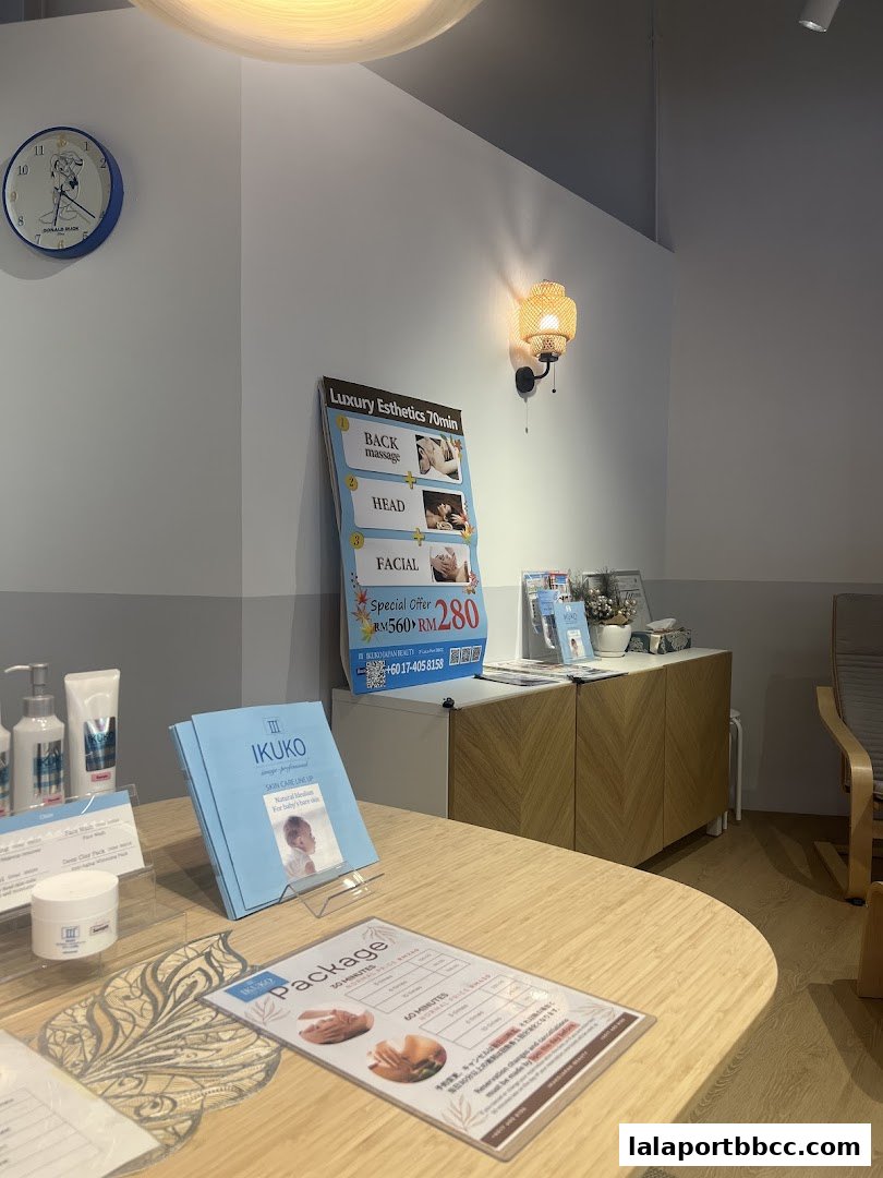Interior of a beauty salon with a clock, promotional posters, and product displays.