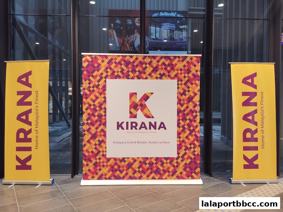 Two yellow banners flank a colorful display for Kirana, showcasing Malaysian finest.