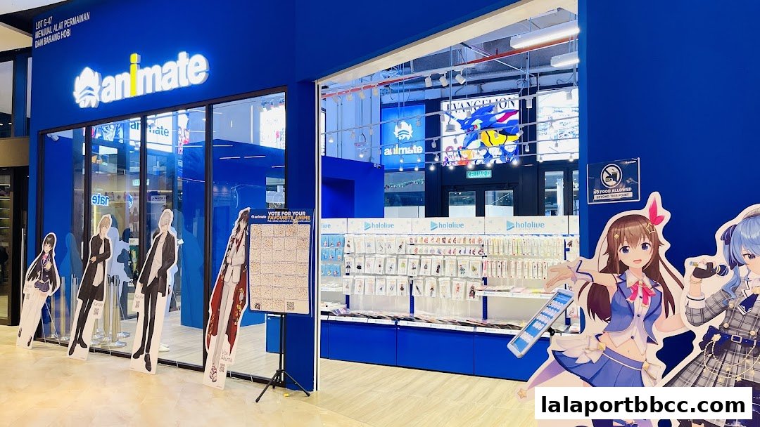 The Animate store entrance features anime character cutouts and merchandise displays.