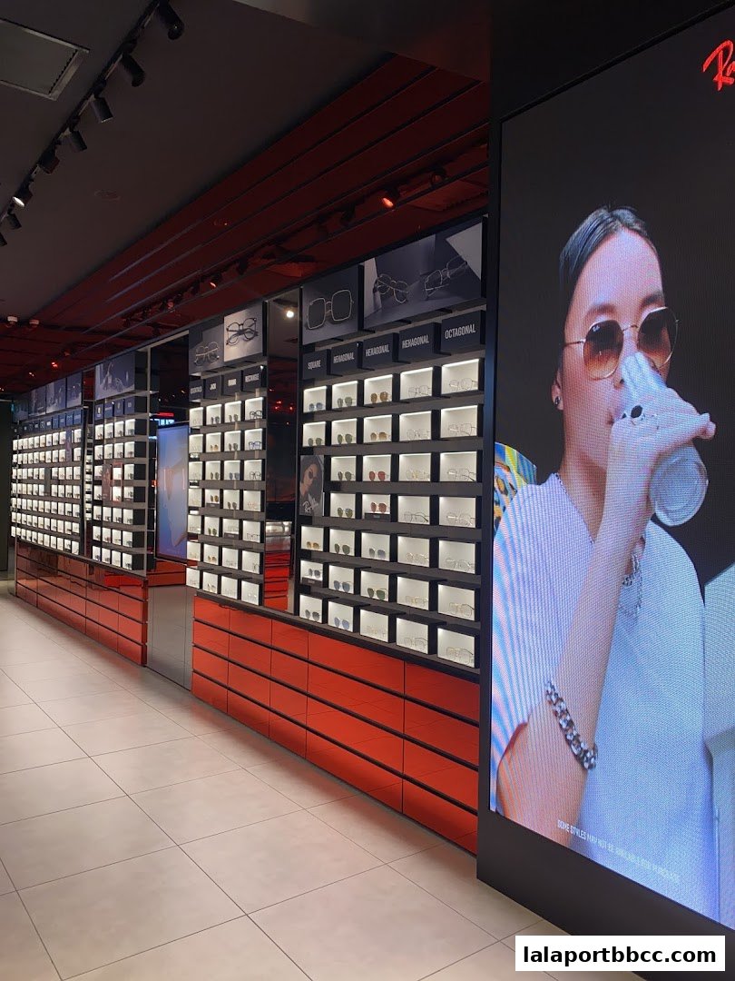 Interior of a Ray-Ban store showcasing a wide selection of sunglasses and eyewear.