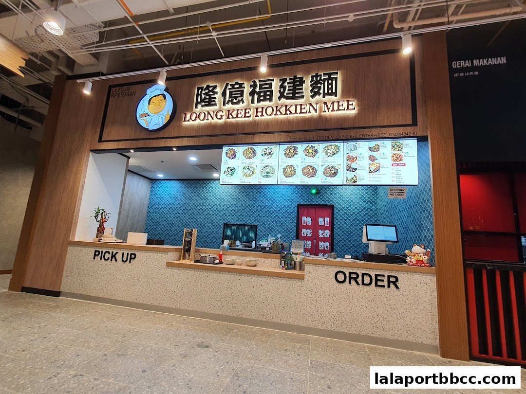 The storefront of Loong Kee Hokkien Mee, featuring a menu display and ordering counter.