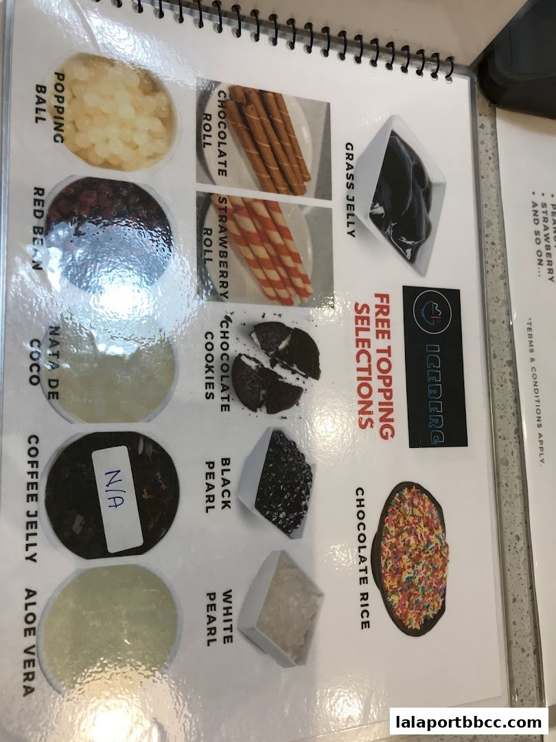 A menu page showcasing various free topping selections for desserts at Iceberg.