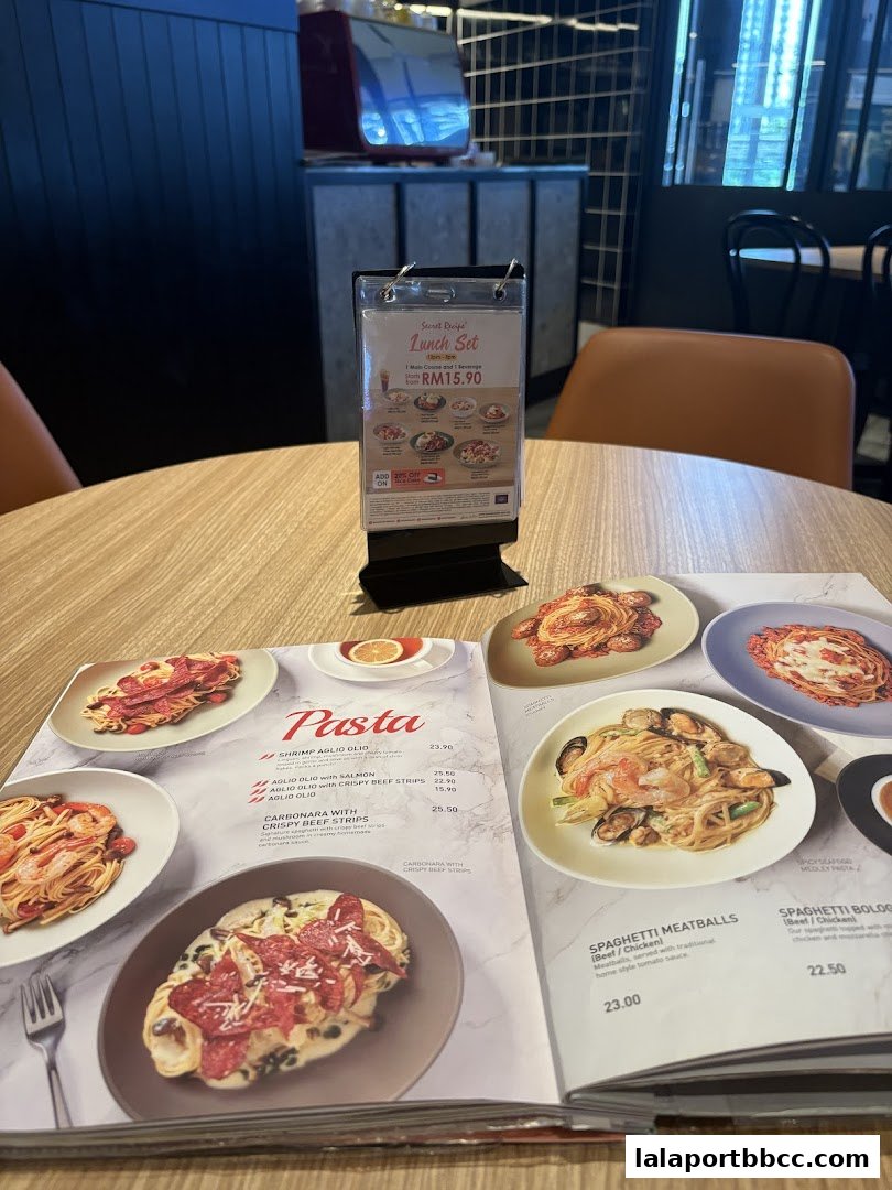 A menu open to the pasta section, with a lunch set offer displayed.