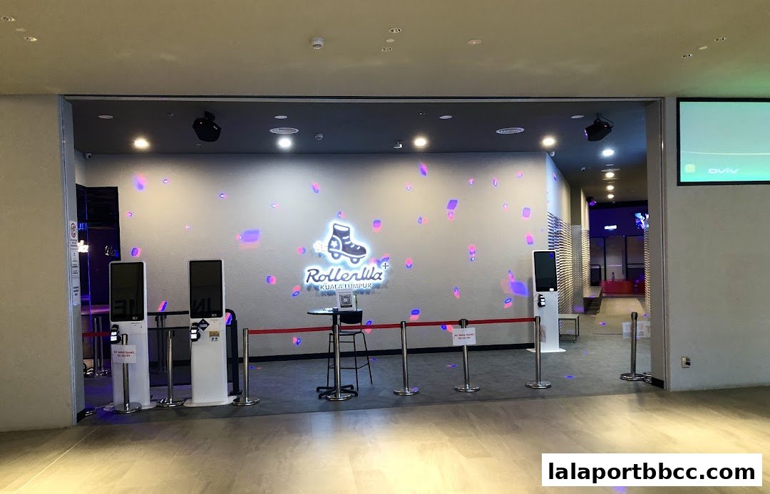 The entrance to Rollerwa Kuala Lumpur, featuring interactive displays and a roller skate logo.