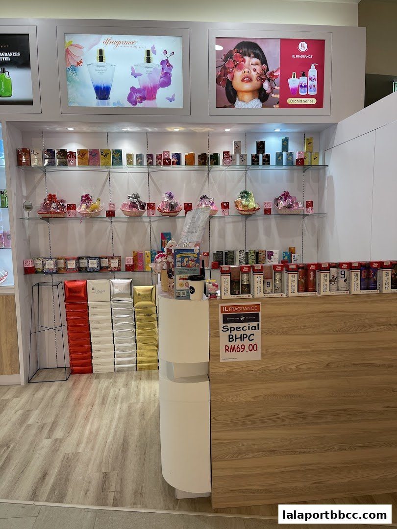 A retail shop displaying various perfumes and gift sets on shelves and a counter.