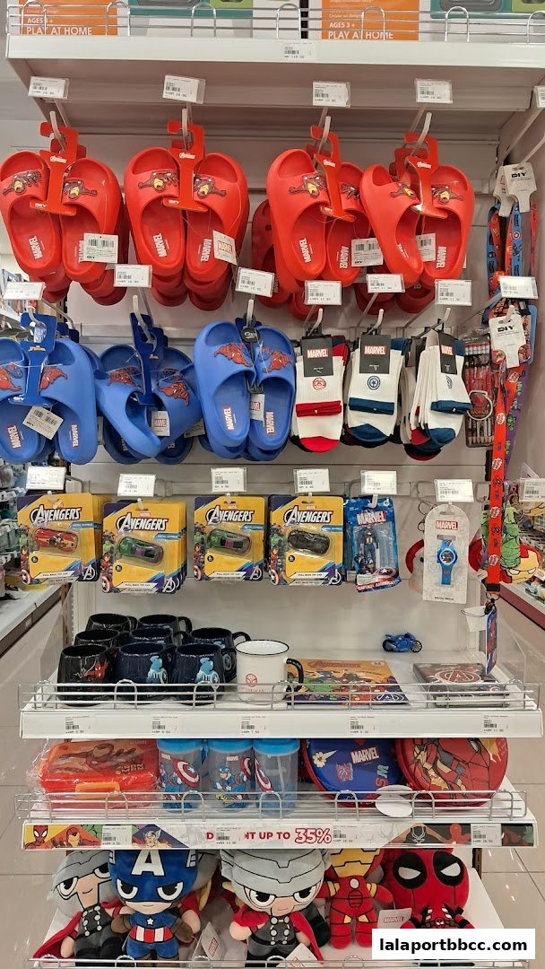 A display of Marvel-themed merchandise including slippers, socks, toys, mugs, and plushies.