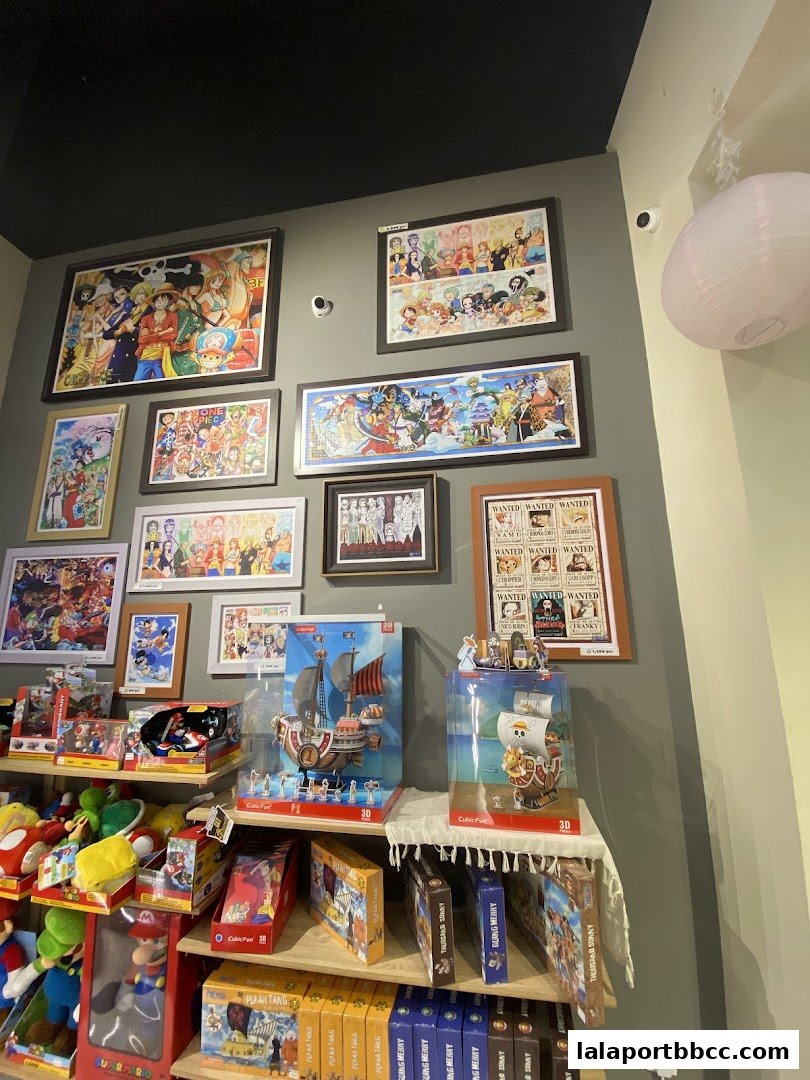 A retail shop interior displaying anime-themed posters, puzzles, and merchandise.