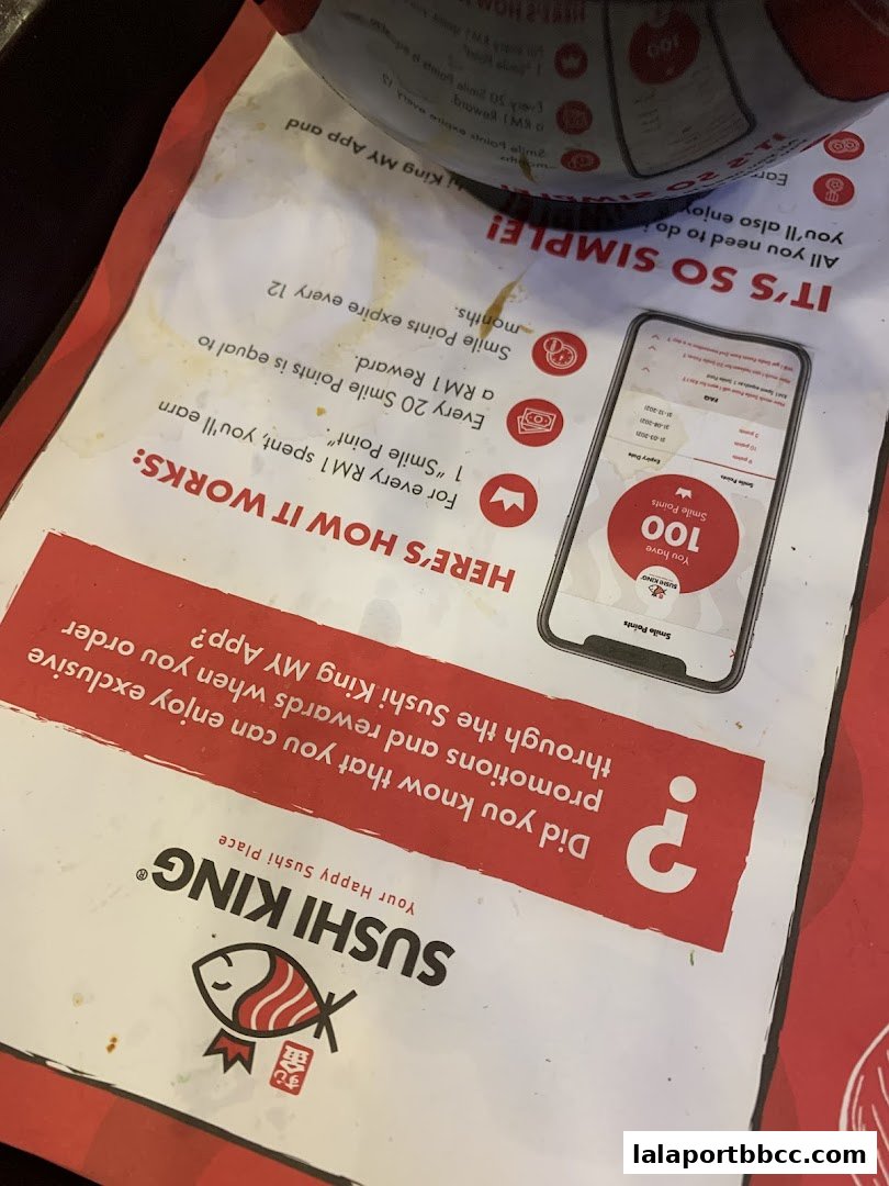 A promotional flyer for Sushi King's loyalty program, detailing how to earn and use Smile Points.