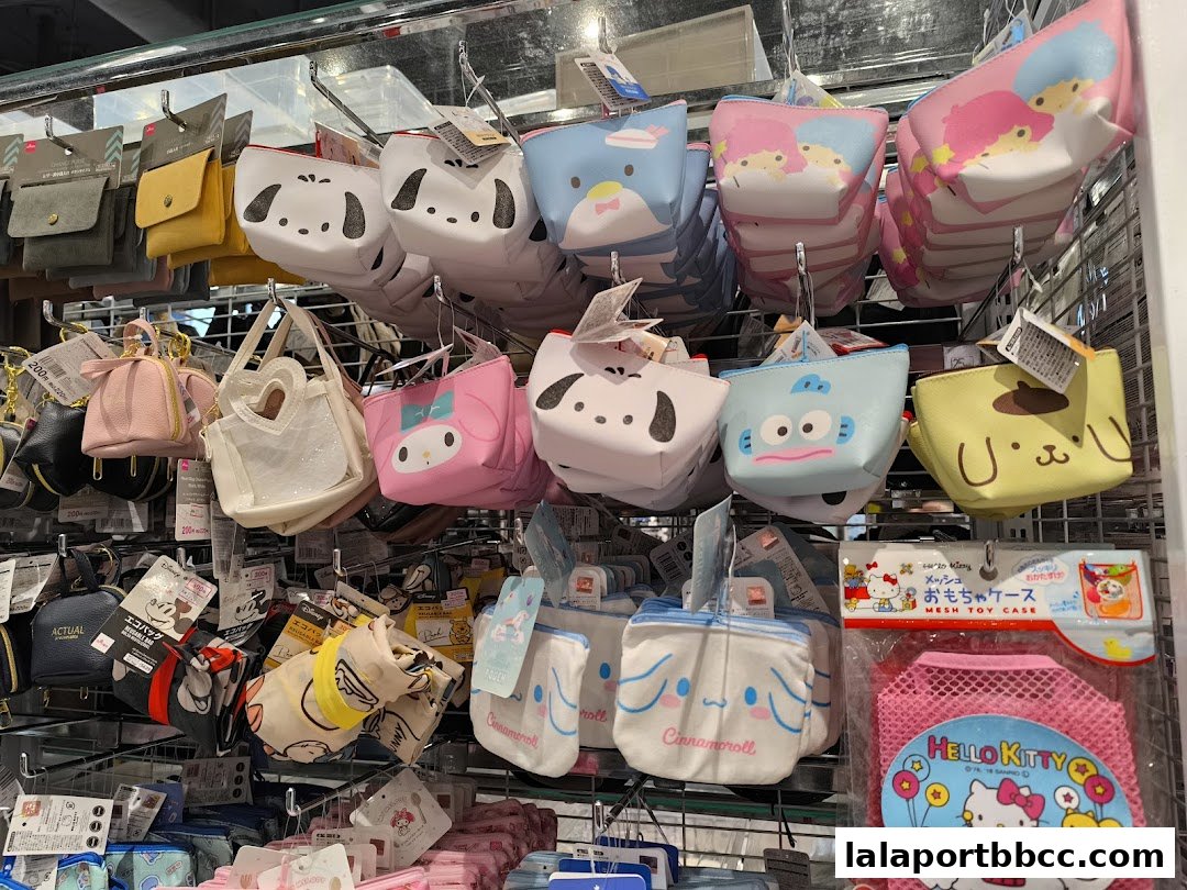 A display of various character-themed pouches and bags, including Sanrio characters.