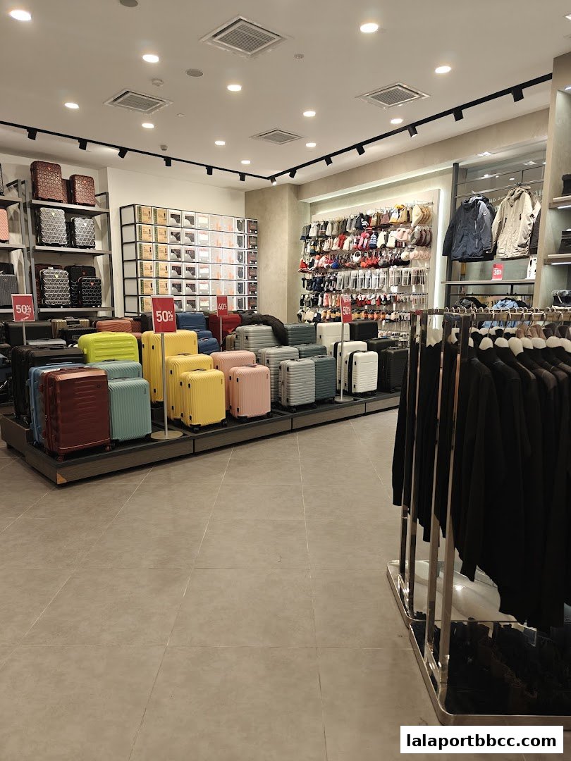 Interior view of a Universal Traveller store showcasing luggage and apparel.