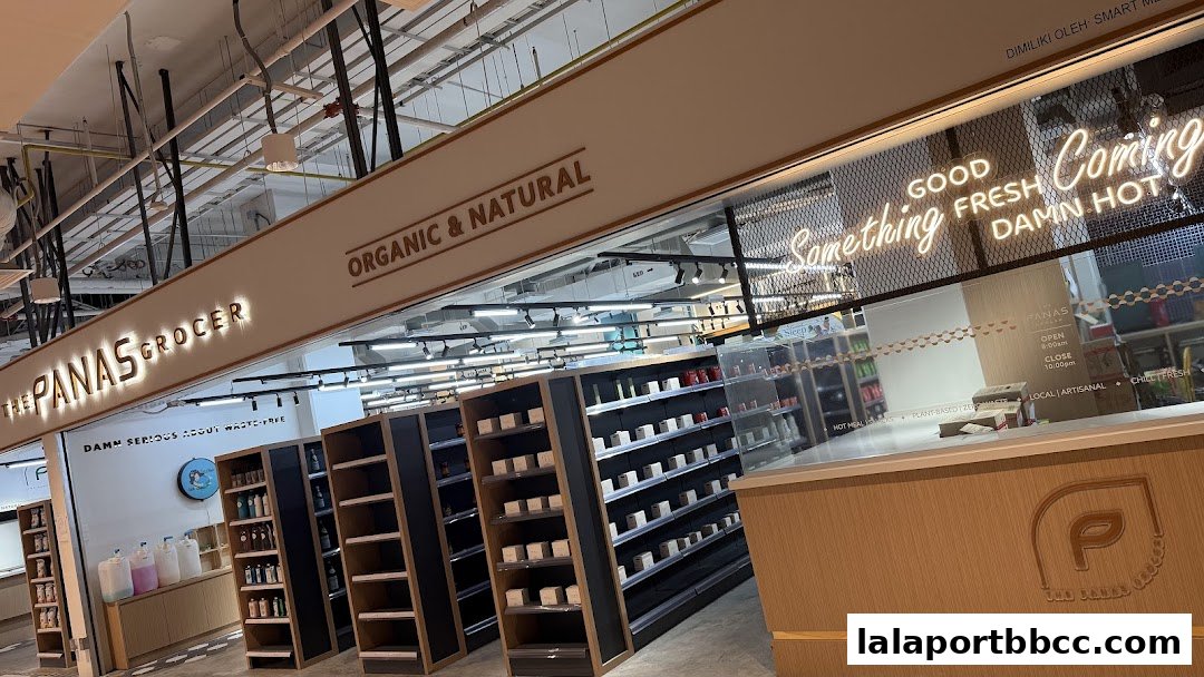 Interior view of The Panas Grocer, showcasing shelves stocked with products and a counter area.