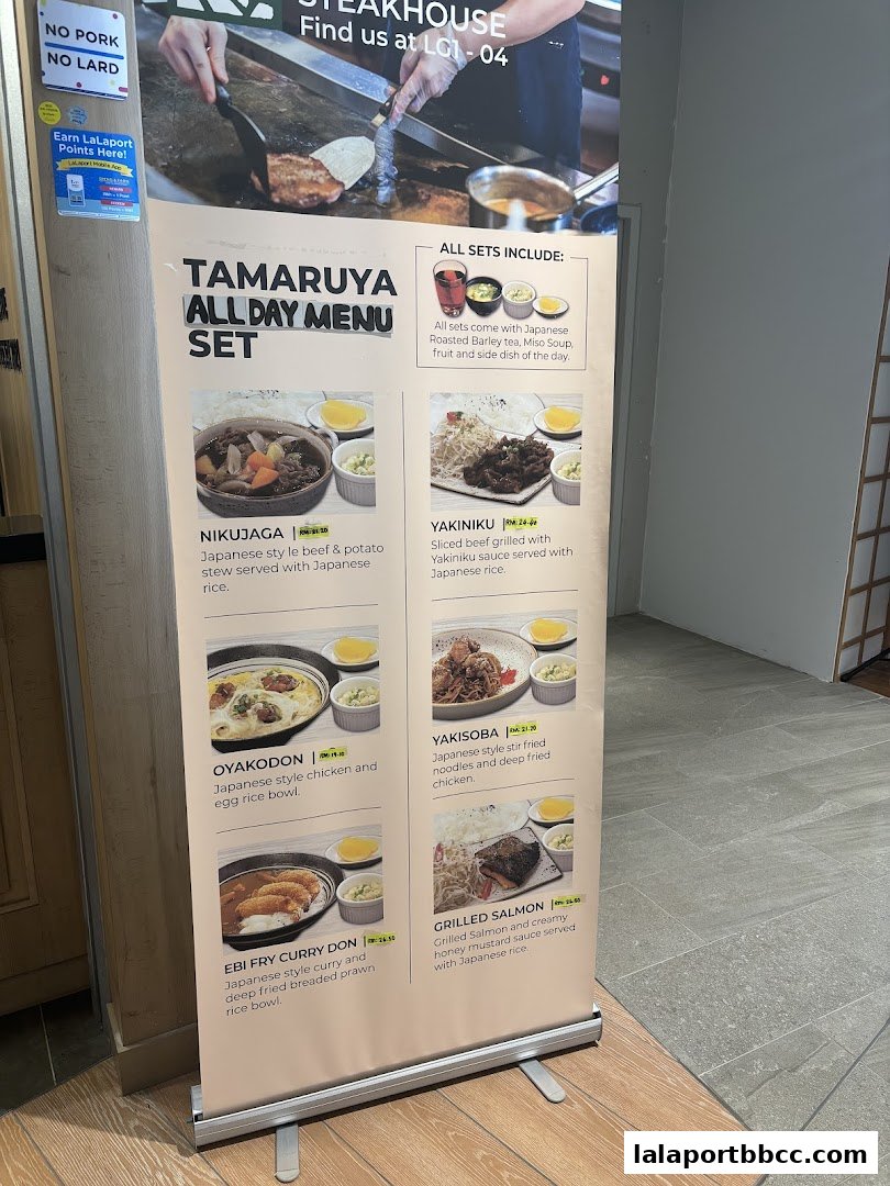 A display banner showcasing the all-day menu sets offered at Tamaruya Honten Steakhouse.