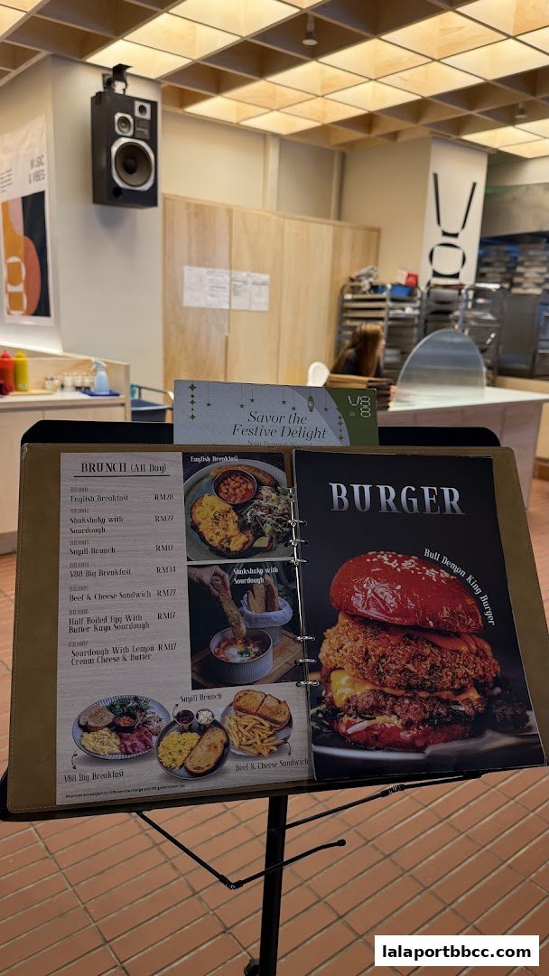 A menu displaying brunch items and a large burger at V88 Cafe and Bar.