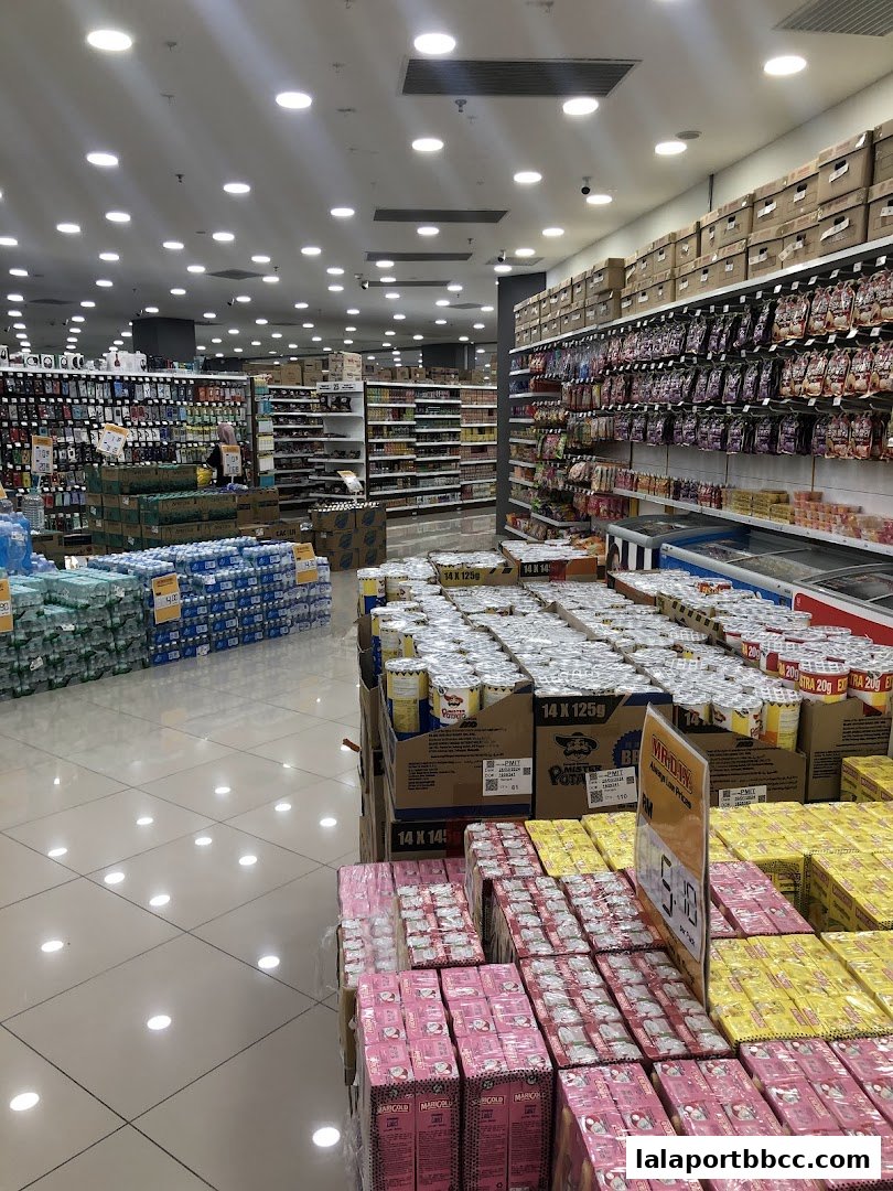 Interior view of a well-stocked MR.DIY PLUS store with aisles of products and shelving.