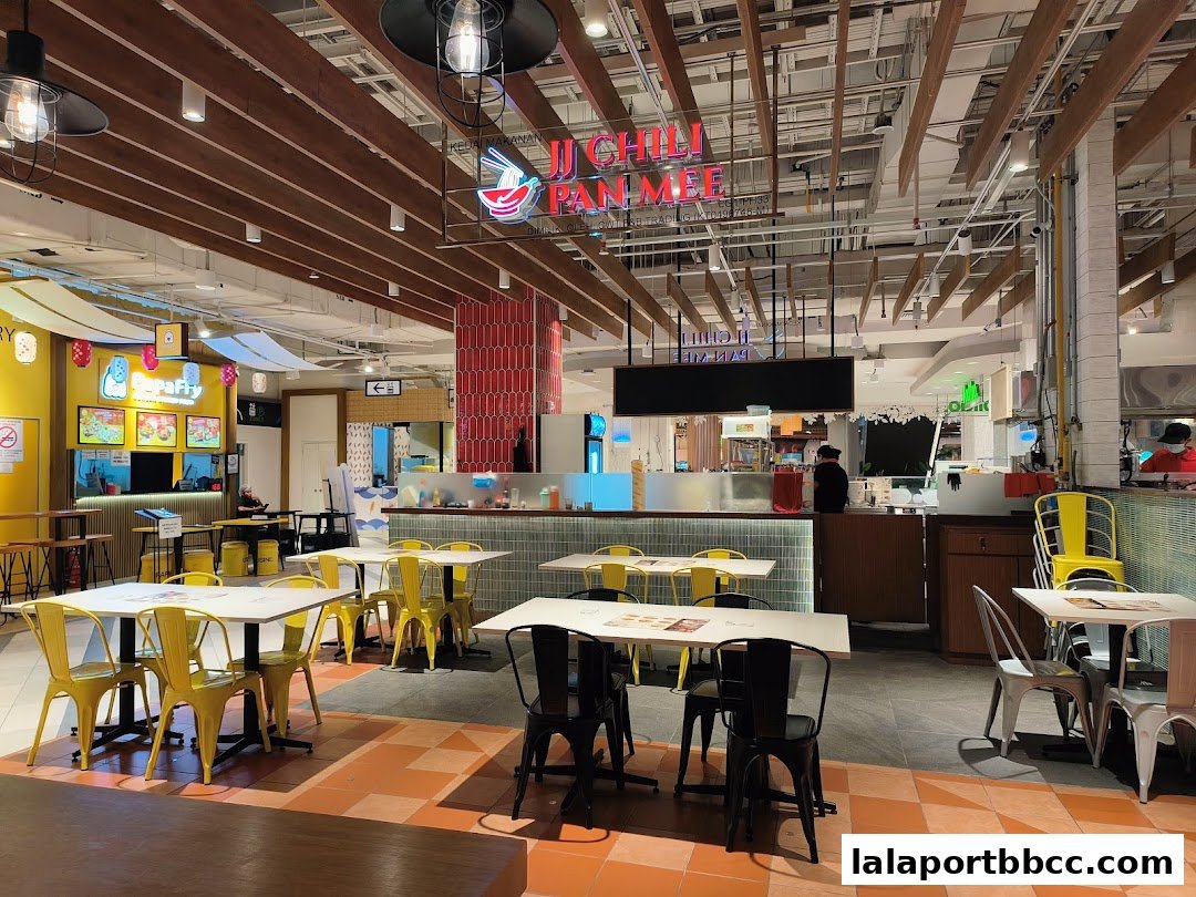 Interior view of JJ Chili Pan Mee restaurant with tables and chairs.