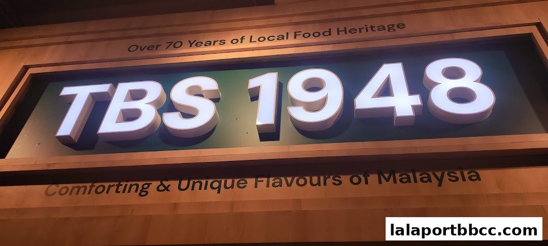 A sign for TBS 1948, highlighting over 70 years of local food heritage and Malaysian flavors.