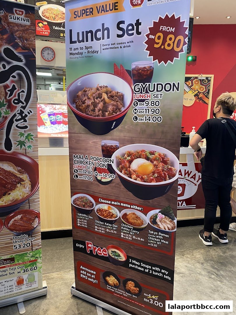 A promotional banner for Sukiya's lunch sets featuring Gyudon and Mala Popcorn Chicken Don.