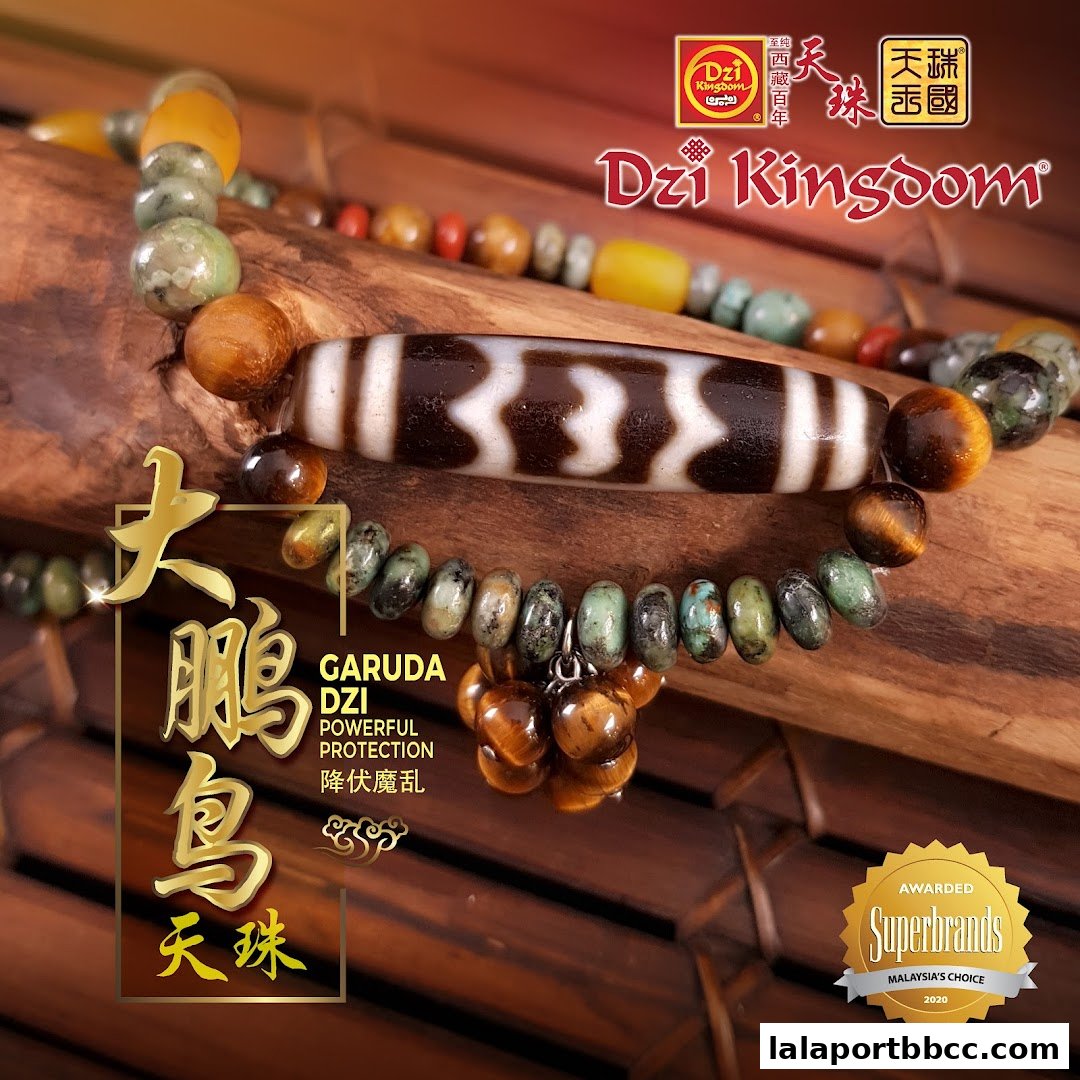 A close-up of a Dzi bead bracelet with Garuda Dzi for powerful protection.