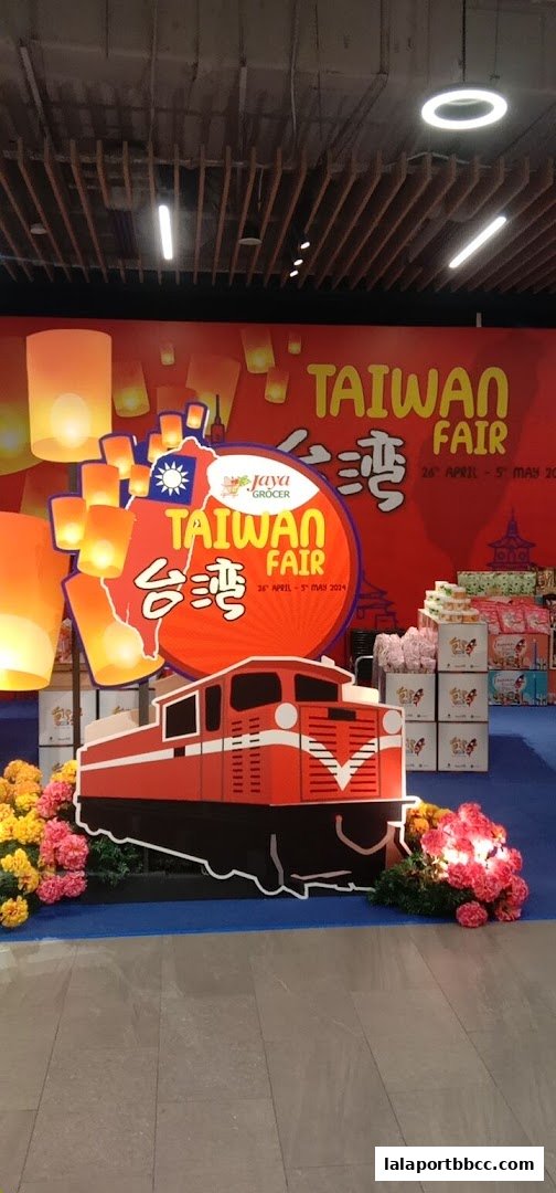 A 'Taiwan Fair' display at Jaya Grocer featuring a train cutout, lanterns, and floral decorations.