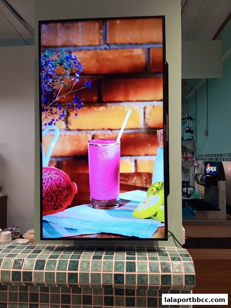 A digital screen displays a vibrant pink smoothie with dragon fruit and apple.