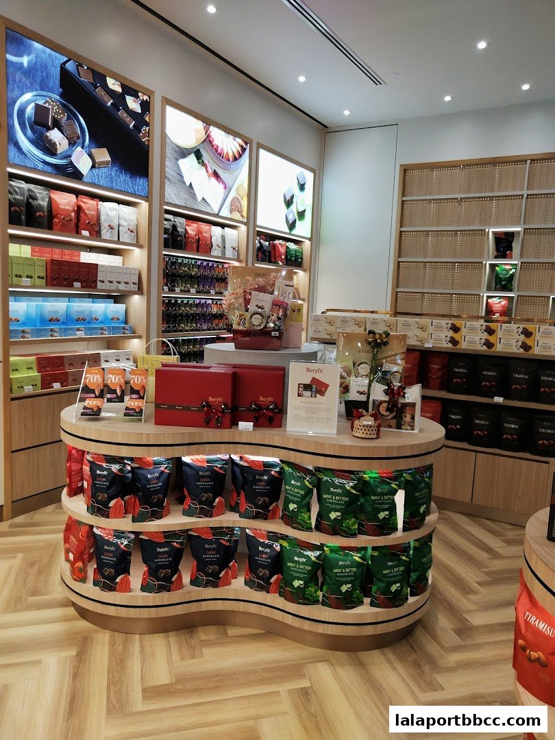 Interior view of a Beryls Chocolate shop with shelves stocked with various chocolate products.
