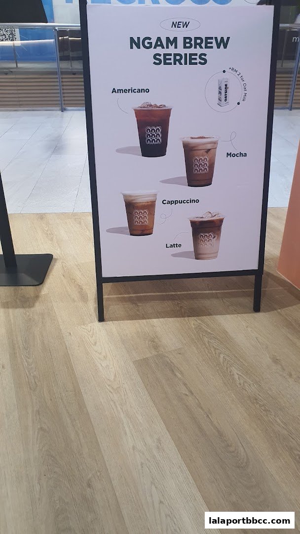 A-frame sign displaying the "Ngam Brew Series" with four coffee drinks.