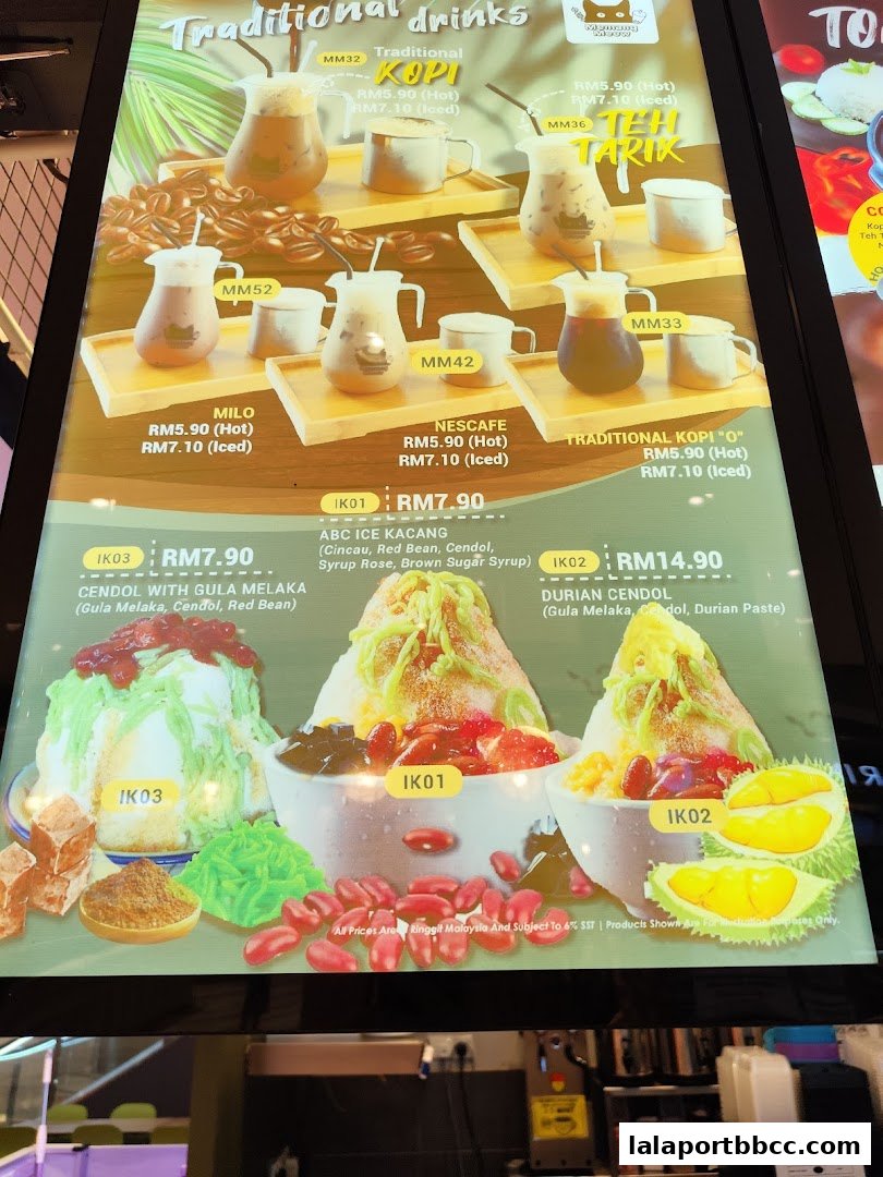 A menu board displaying traditional Malaysian drinks and desserts with prices.