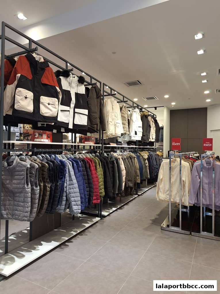 Interior view of a clothing store showcasing a wide selection of jackets and vests on display racks.