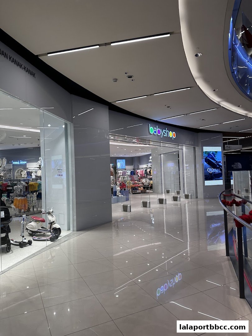 The entrance to Babyshop BBCC, showcasing children's clothing and accessories.