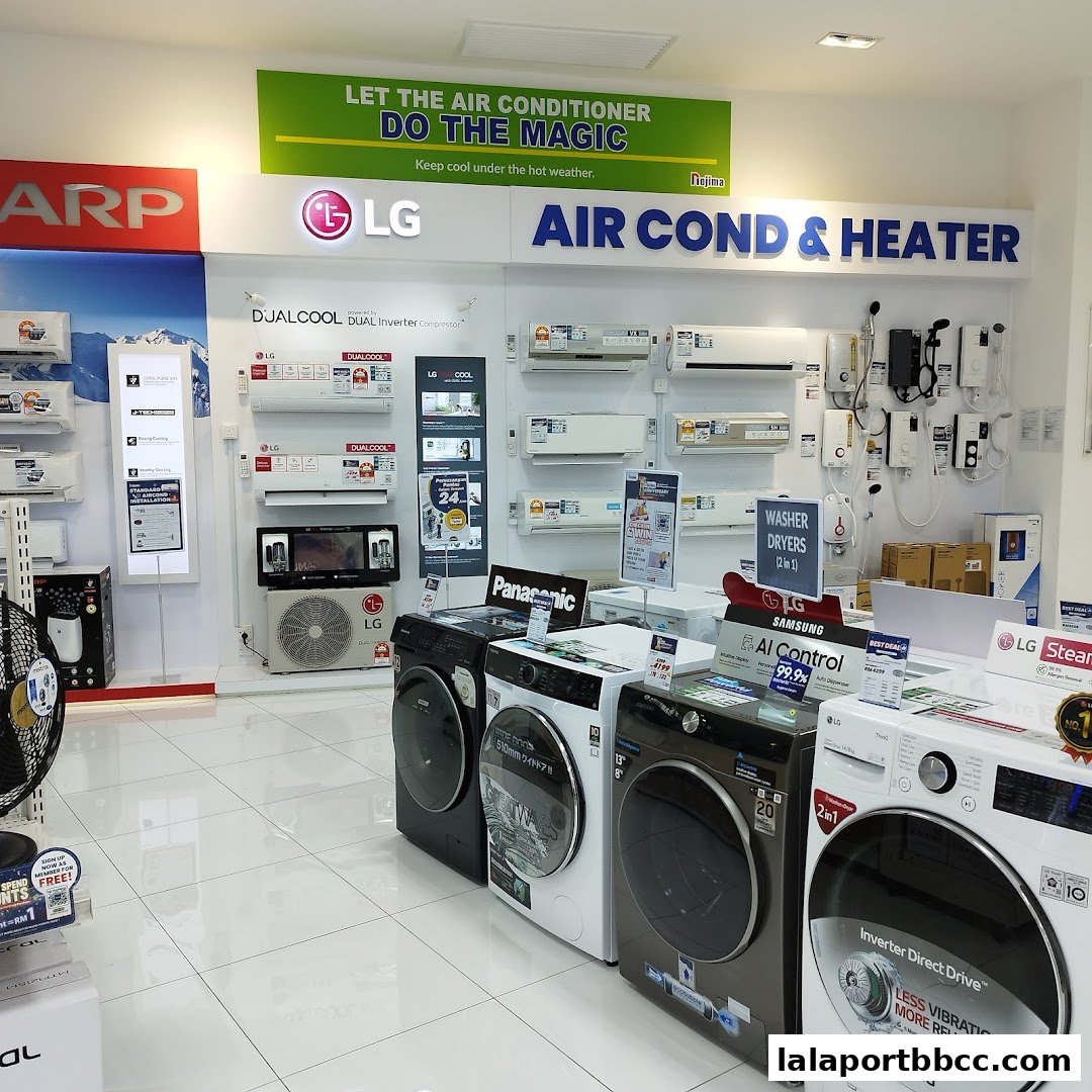 A retail store display featuring LG air conditioners and various washing machines and dryers.