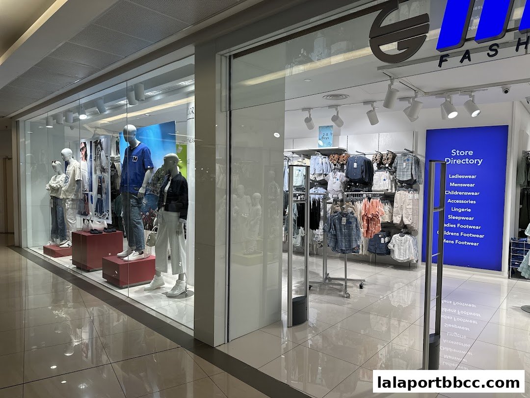 The exterior of a Max Fashion store showcasing mannequins and clothing displays.