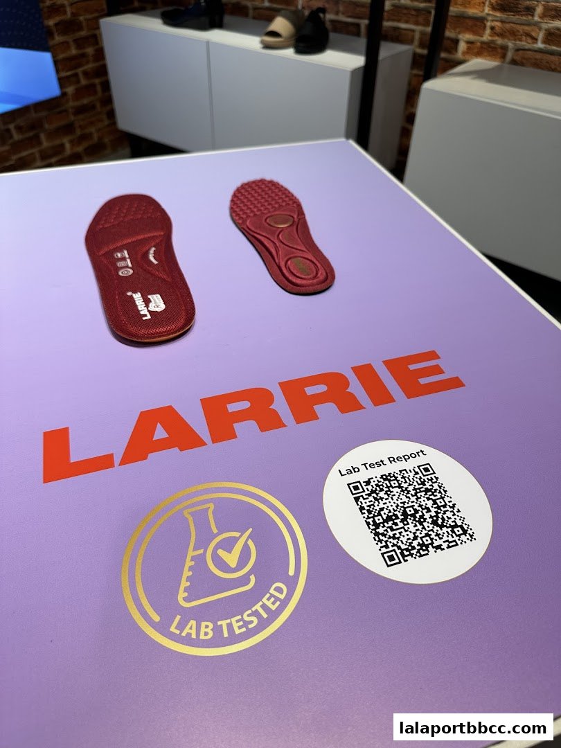 Larrie brand insoles displayed on a purple surface with a 'Lab Tested' seal and QR code.