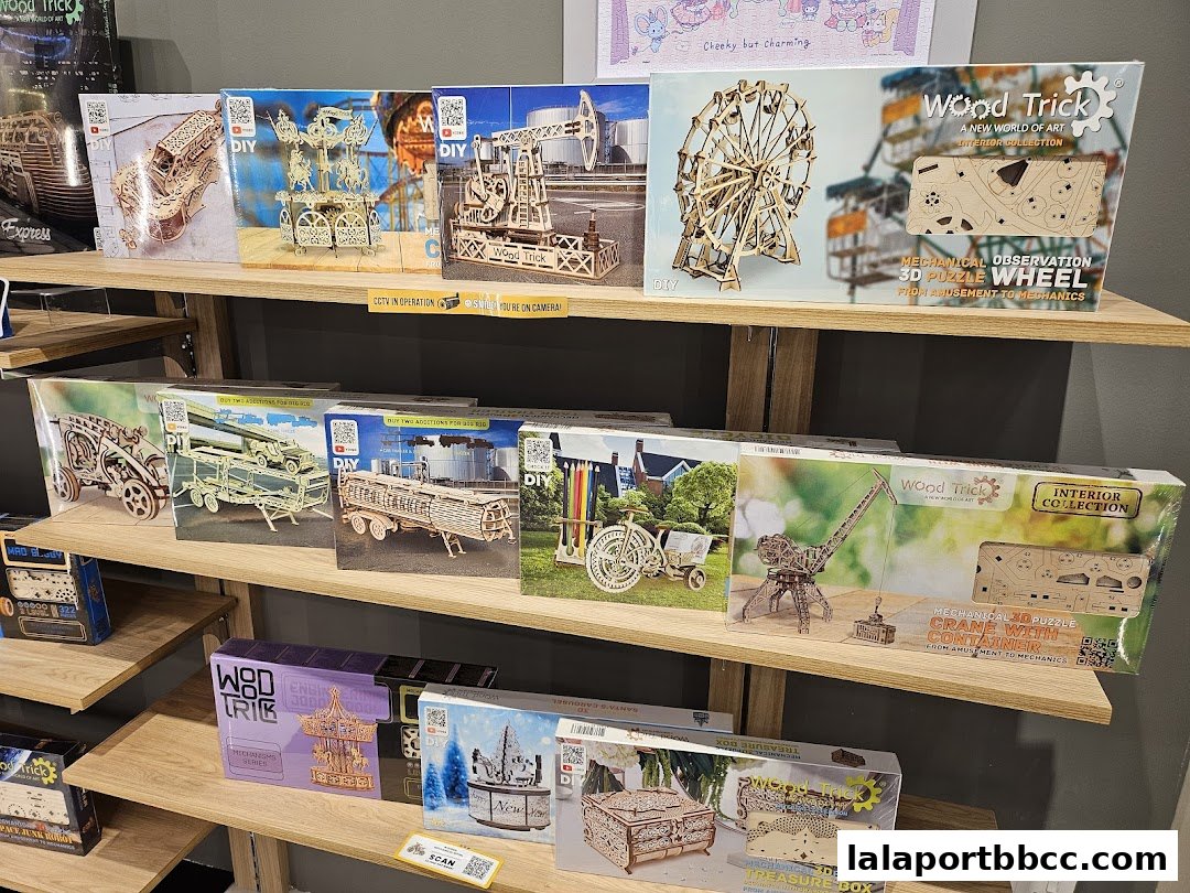 Shelves filled with intricate wooden 3D puzzle kits from Wood Trick.