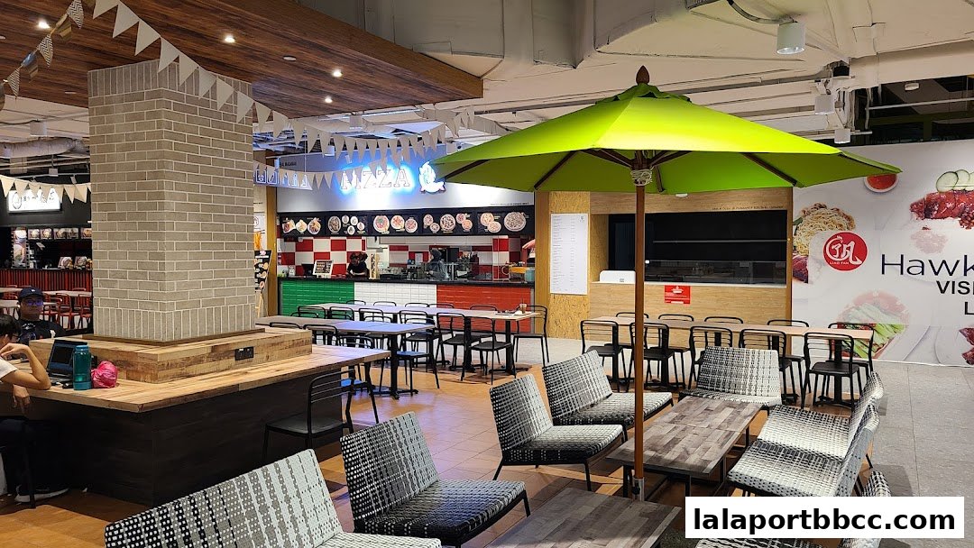 Interior view of an Italian restaurant with seating, tables, and a food counter.