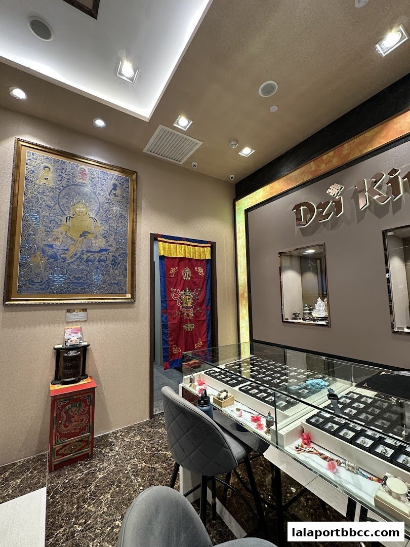 Interior of Dzi Kingdom shop with display cases filled with jewelry and Tibetan art.