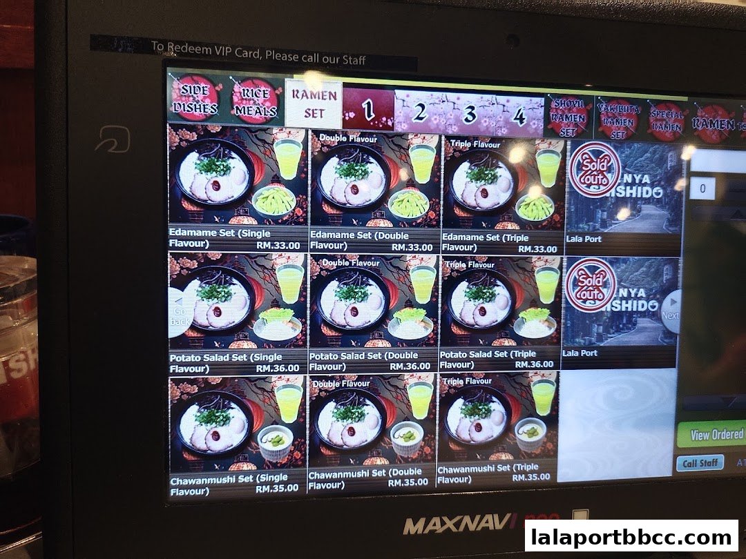 A digital menu displaying various ramen sets, side dishes, and drinks at Menya Shishido.