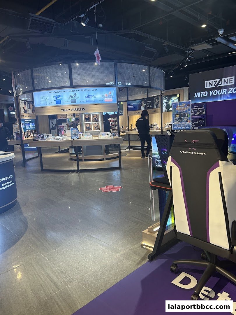 Interior of a Sony Store showcasing headphones, gaming chairs, and other electronics.