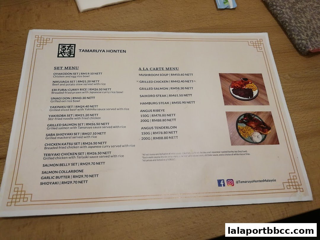 A menu from Tamaruya Honten featuring set meals and a la carte options with prices.