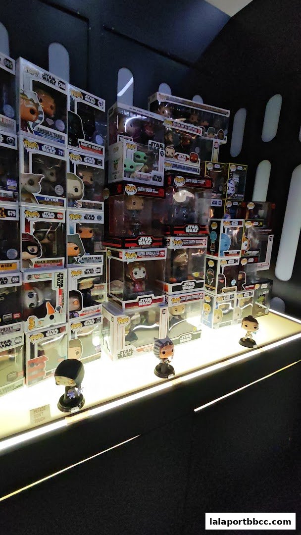 A display of Star Wars Funko Pop figures, featuring characters like Ahsoka Tano and Darth Vader.