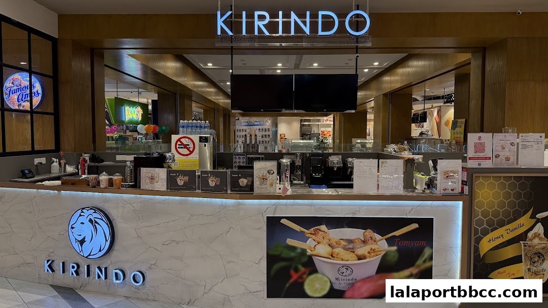 The Kirindo shop front features a modern counter with menu displays and a prominent logo.