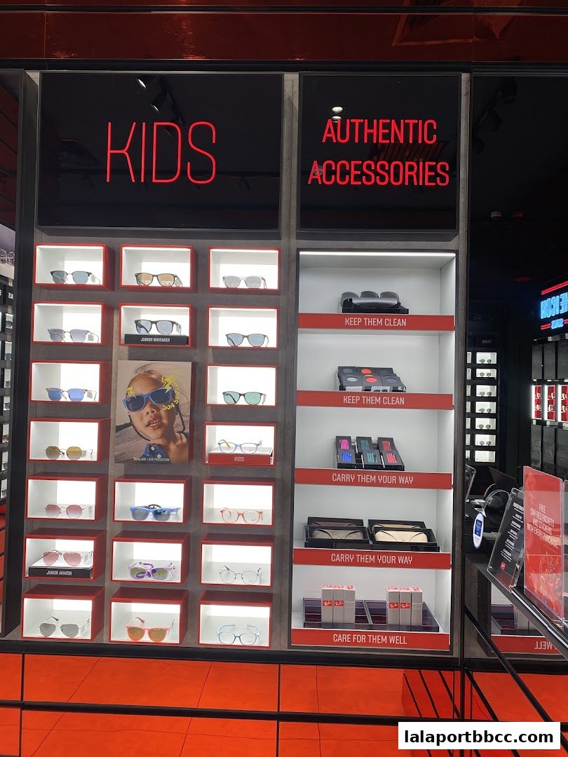 A display of Ray-Ban sunglasses for kids and adults, with accessories.