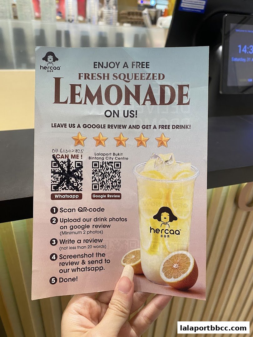 A flyer offering a free fresh squeezed lemonade from Hercaa for leaving a Google review.